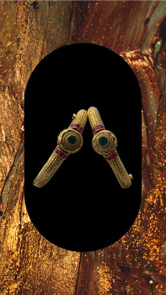 Gold plated bangles adorned with ruby and emerald stones with screw lock