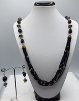Long black crystal beaded necklace set with gold plated metal oxidized pcs and earrings