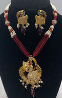 Short gold plated peacock pendant set with moti and bead work with matching earrings