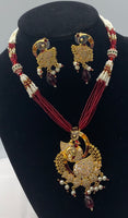 Short gold plated peacock pendant set with moti and bead work with matching earrings