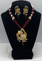 Short gold plated peacock pendant set with moti and bead work with matching earrings