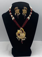 Short gold plated peacock pendant set with moti and bead work with matching earrings