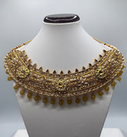 Gold plated choker style necklace adorned with polki kundan and high quality beads