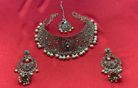 Gold plated choker style necklace set with matching earrings and head piece adorned with cream colour beads