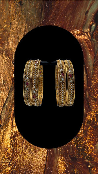 Oxidized Gold plated bangles adorned with ruby and white stones with moti work