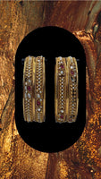 Oxidized Gold plated bangles adorned with ruby and white stones with moti work