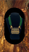 Choker style Gold plated pendant with green moti string without earrings