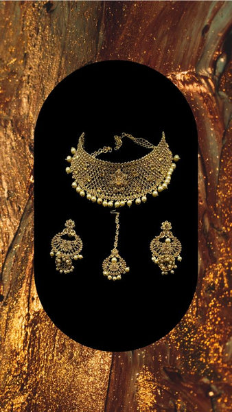 Gold plated choker style necklace set with matching earrings and head piece adorned with cream colour beads