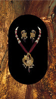 Short gold plated peacock pendant set with moti and bead work with matching earrings