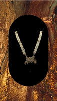 Long beaded necklace with gold plated pendant adorned with multi coloured diamonds