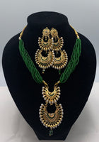 Short green moti with gold plated pendant set with earrings