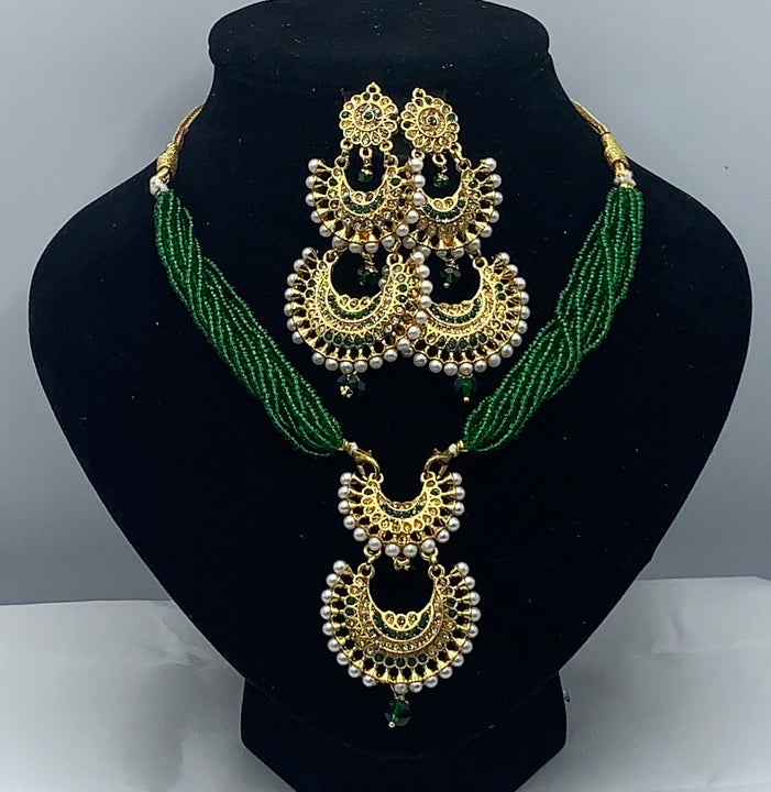 Short green moti with gold plated pendant set with earrings
