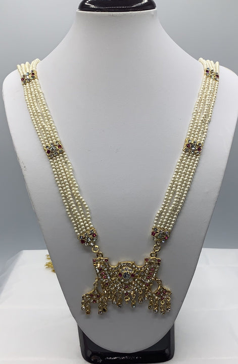 Long beaded necklace with gold plated pendant adorned with multi coloured diamonds