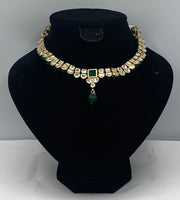 Reversible Choker style gold plated kundan necklace adorned with emerald stone in the centre