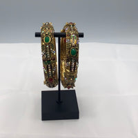 Gold plated minnakari design bangles studded with white zirconia diamonds