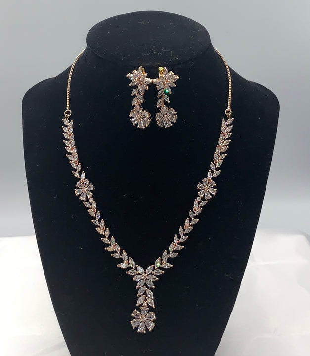 Rose gold plated necklace set with matching earrings adorned with high quality Zarconia white diamonds.