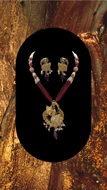Short gold plated peacock pendant set with moti and bead work with matching earrings