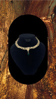 Reversible Choker style gold plated kundan necklace adorned with emerald stone in the centre