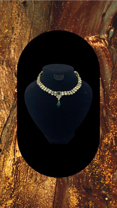 Reversible Choker style gold plated kundan necklace adorned with emerald stone in the centre